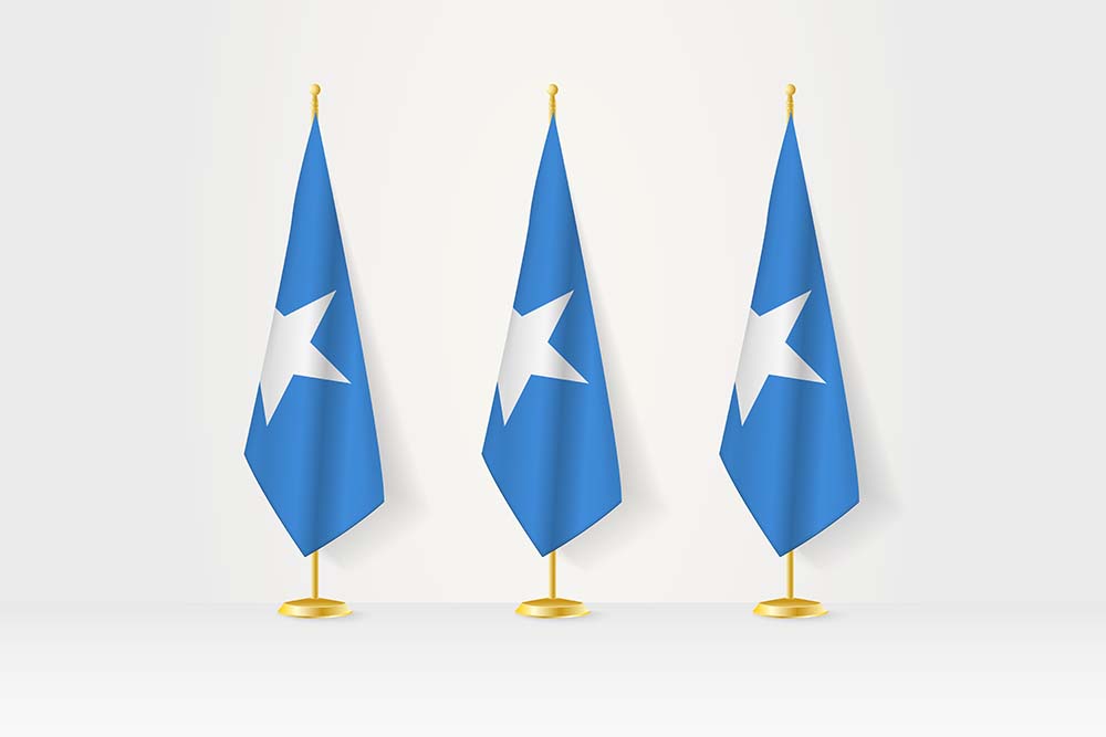 Three Somali flags in a row on a golden stand illustration